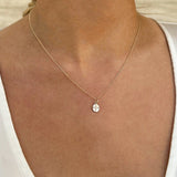 14kt Gold Oval Pendant and Diamond Cross necklace