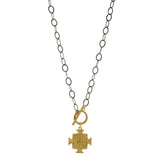 Our ARIANA - EDGE cross pendant necklace, combines classic with a little edge. A large, matte gold, cross pendant is suspended from a 14kt gold-filled toggle on an oxidized, sterling silver chain. Add a little bit of edge day or night. Made to last and made in the USA. Chain measures 18" .