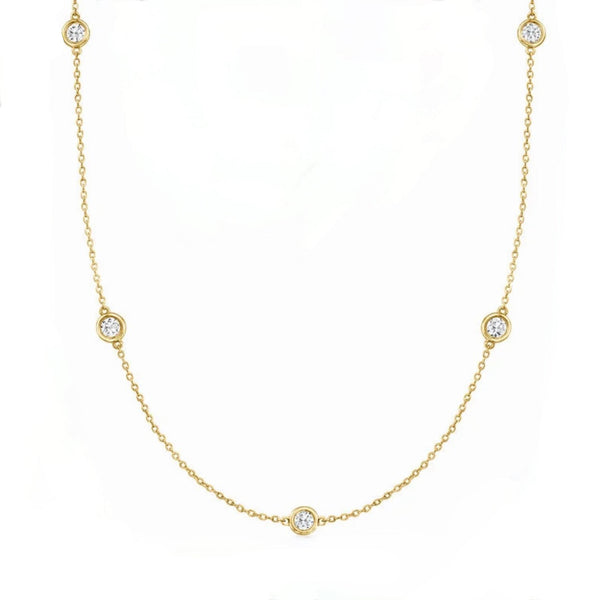 14kt Gold necklace with bezel set diamonds on a white background
