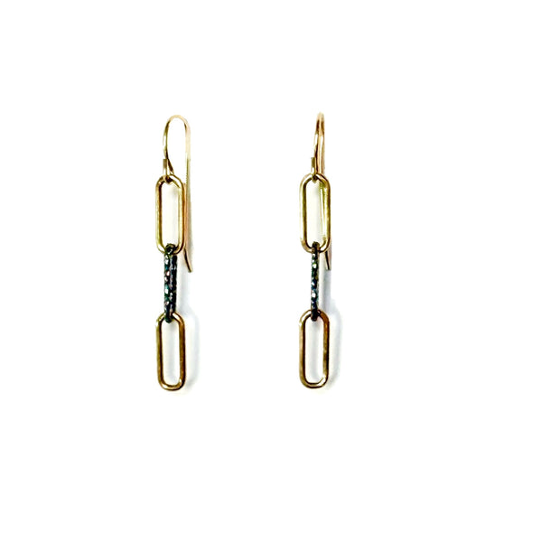 Gold chain earrings on a white background
