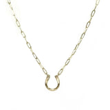 Our small golden links chain is connected by a hand-hammered, polished, gold-filled horseshoe pendant The necklace is displayed against a solid white background.